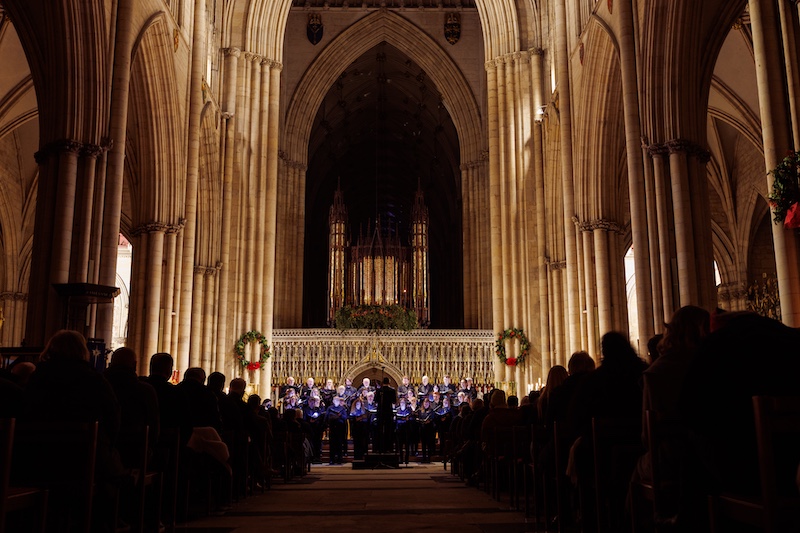 Image of the packed interior of York Minster, looking towards the choir